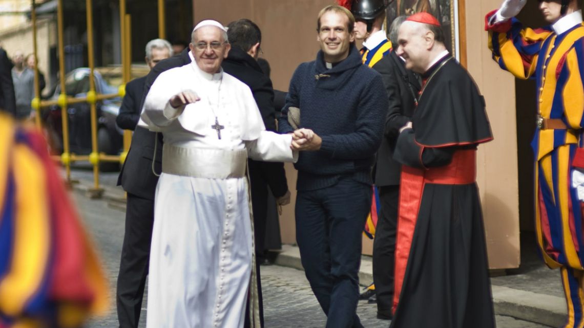 Pope Francis is flanked by Gonzalo Aemilius as he greets faithful at the Vatican