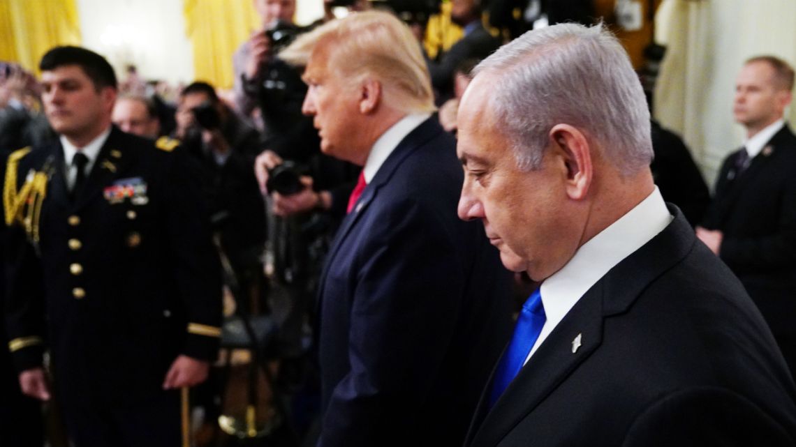 US President Donald Trump and Israel's Prime Minister Benjamin Netanyahu enter the East Room for an announcement of Trump's Middle East peace plan at the White House in Washington, DC on January 28, 2020. 