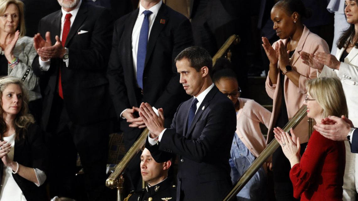 Venezuelan opposition leader Juan Guaido applauds as President Donald Trump delivers his State of the Union address to a joint session of Congress on Capitol Hill in Washington.
