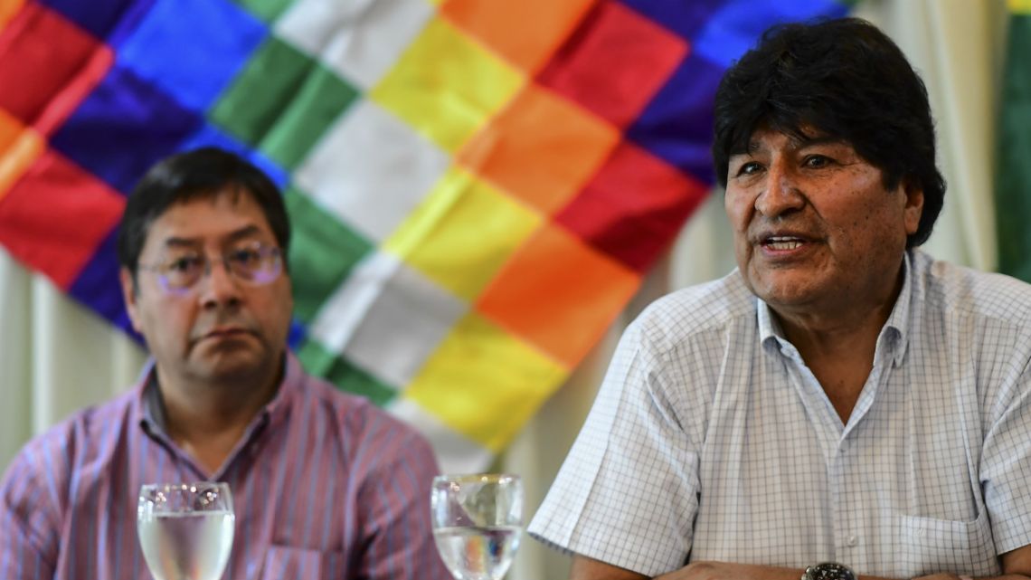 Bolivia's former President, Evo Morales, speaks next to Bolivian presidential candidate for the Movement for Socialism (MAS) party, Luis Arce, during a private meeting with members of their party, in Buenos Aires.