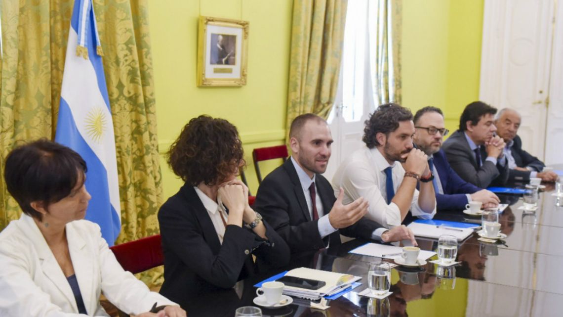 Economy Minister Martín Guzmán (center left) and Cabinet Chief Santiago Cafiero (center right), among other officials, during the first reunion of Economic and Social Council in the Casa Rosada on February 20 2020.