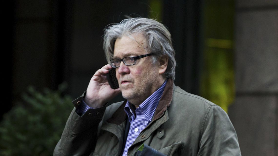 Steve Bannon, former Chief Strategist for US President Donald Trump, talks on the phone outside Trump Tower in New York on December 9, 2016.