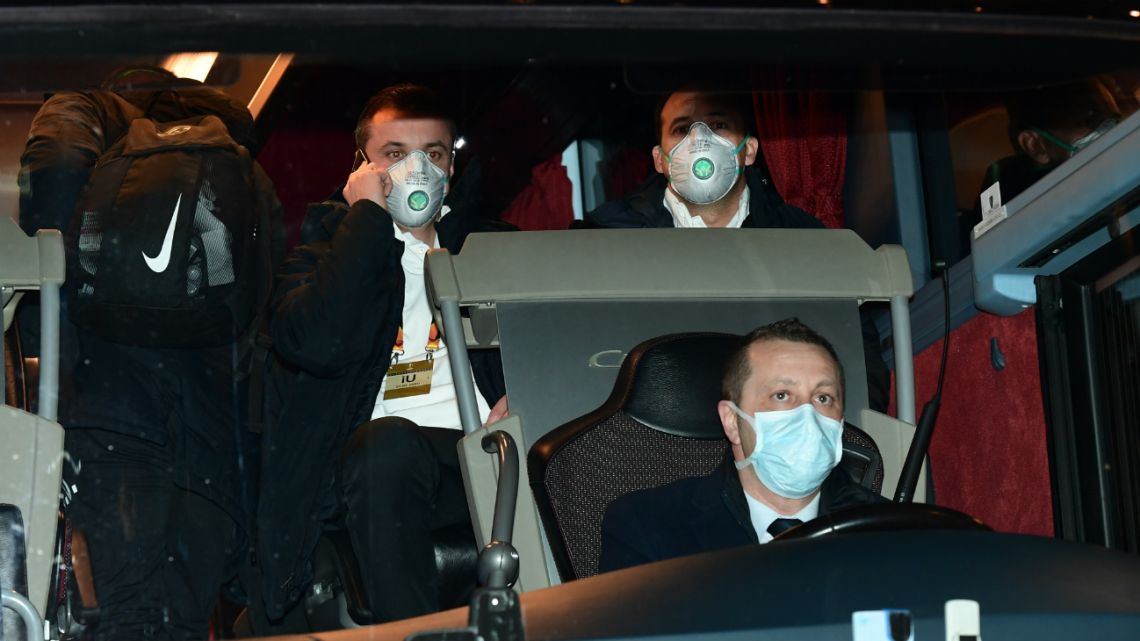 Players of Ludogorets wear protective face masks as a safety measure against the COVID-19, on their way to compete in the UEFA Europa League football match on February 27, 2020, in Milan.