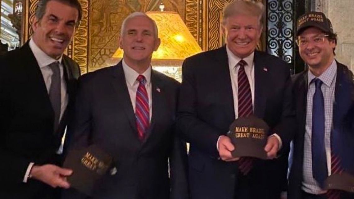 Fabio Wajngarten (far right) embraces Donald Trump, in this photograph taken during the trip to Washington.