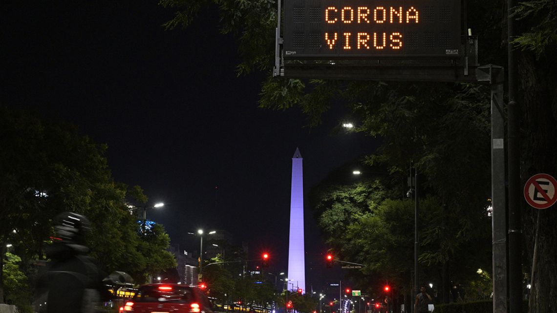 An electronic traffic board displays a message informing Coronavirus symptoms on the central avenue of 9 de Julio, in Buenos Aires, on March 12, 2020. 
