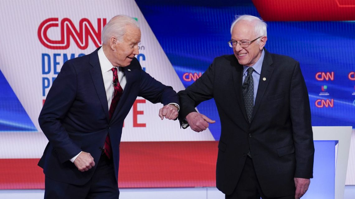 Former Vice President Joe Biden, left, and Senator Bernie Sanders, right, participate in a Democratic presidential primary debate at CNN Studios in Washington.