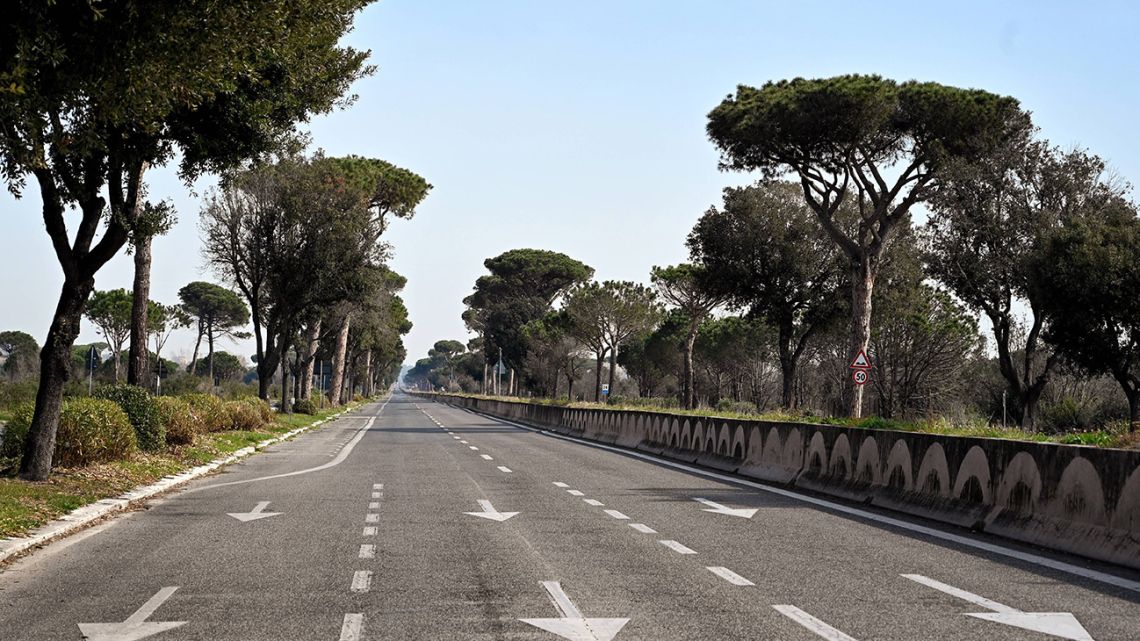 A photograph taken on March 21, 2020 shows the empty Cristoforo Colombo street in Castelfusano in the suburbs of Rome.
