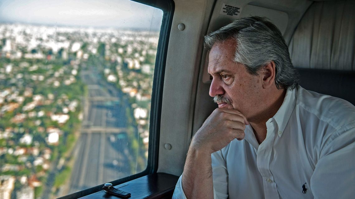 Handout picture released by the Presidency showing President Alberto Fernández overflying the city of Buenos Aires on March 21, 2020.