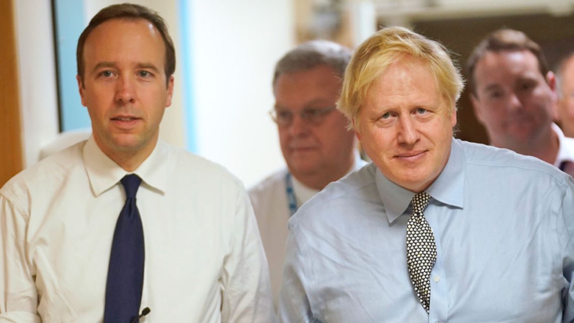 Britain’s Prime Minister Boris Johnson, right, and Health Minister Matt Hancock, pictured in November 2019, have both tested positive for the new coronavirus.