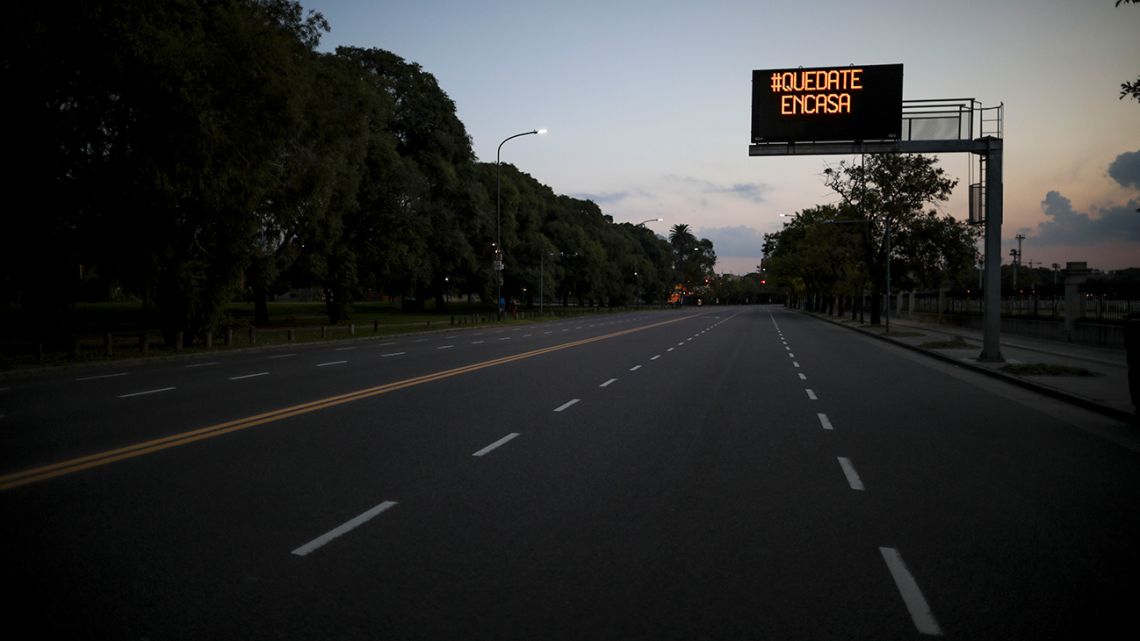 A sign reading "Stay Home" hangs over an empty avenue in Buenos Aires. The government has ordered a forced lockdown until end of March to contain the spread of the new coronavirus. 