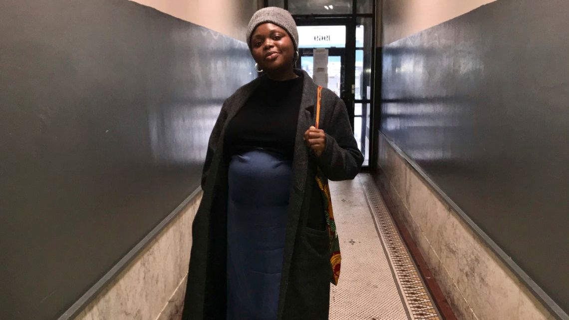 This February 1, 2020 photo provided Maureen Nicol shows her in Harlem, N.Y. Nicol, a single Columbia University PhD student pregnant with her first child, will be giving birth out of state, not as planned. 