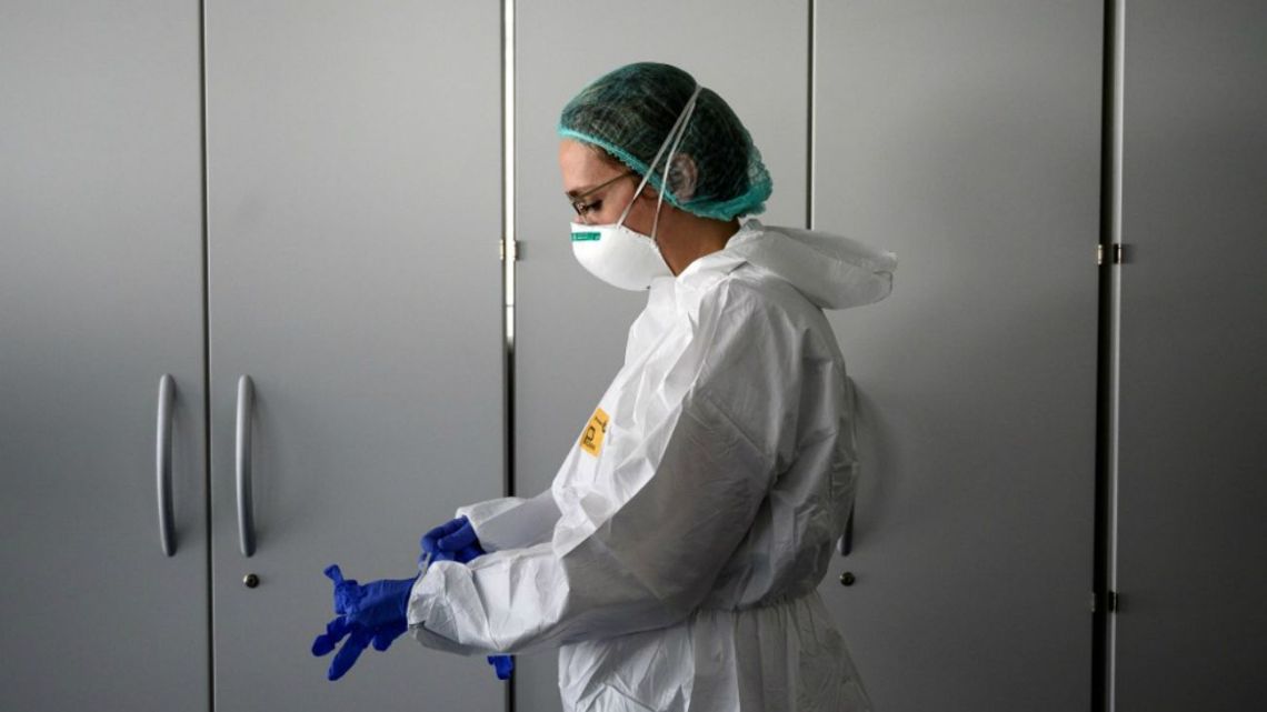 A hospital workers prepares for a shift seeing patients infected with Covid-19.