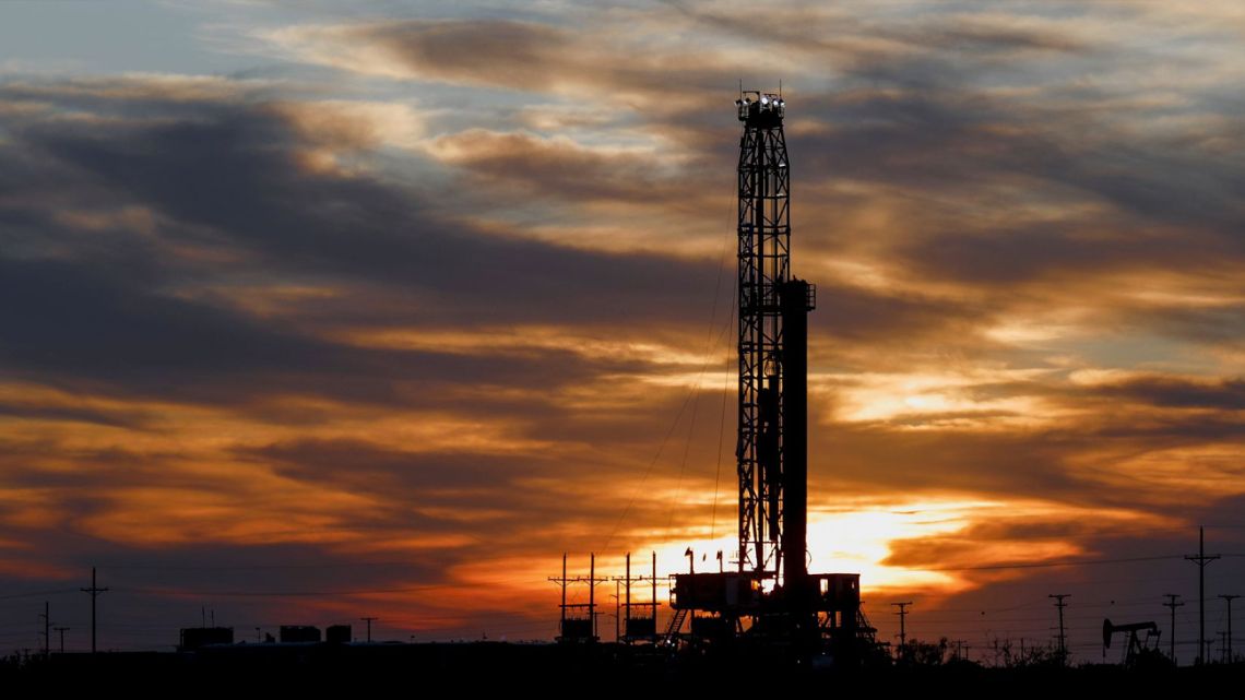 An oil rig stands against the setting sun in Midland, Texas on Friday, April 17, 2020.