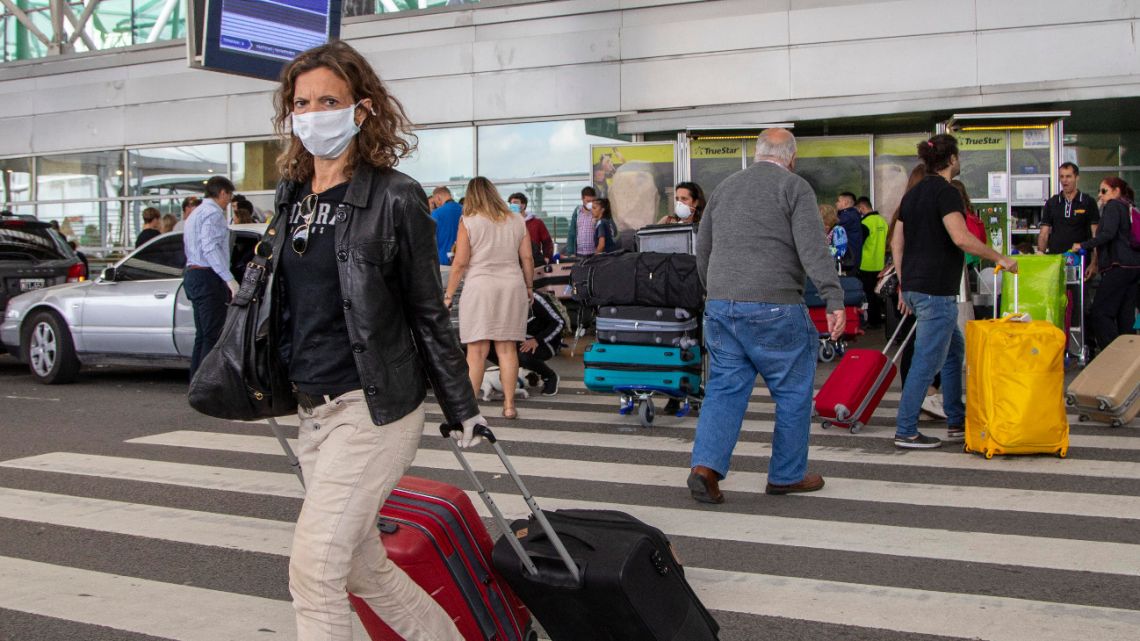 Passengers of regular flights arrive at Ezeiza airport on March 17, 2020.