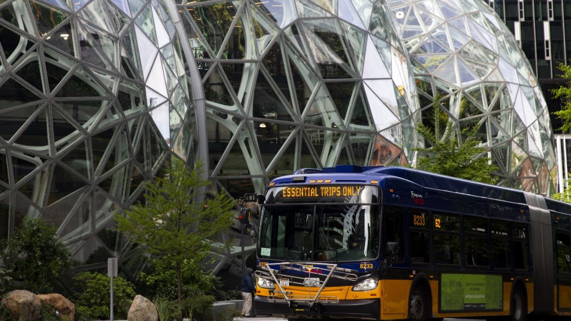 A King County Metro bus for essential trips only passes by The Spheres at the Amazon campus on April 30, 2020 in Seattle, Washington.