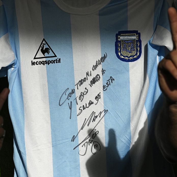 Buenos Aires Times Maradona Autographs Shirt To Help Poor During Pandemic