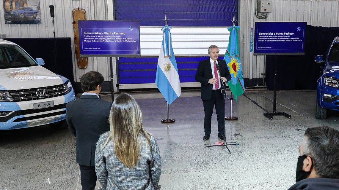 Handout picture released by Presidency shows President Alberto Fernández delivering a speech at the Volkswagen Argentina factory after it resumed production, in General Pacheco, Buenos Aires Province, on May 19, 2020.