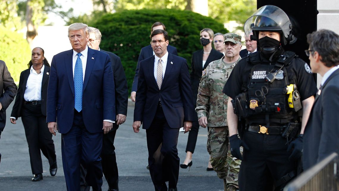 In this June 1, 2020 photo, US President Donald Trump departs the White House to visit outside St. John's Church in Washington.