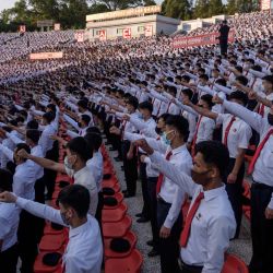 Corea Del Norte.Estudiantes y jóvenes asisten a una reunión masiva denunciando 'desertores del norte', en el Teatro al aire libre Pyongyang Youth Park. | Foto:Kim Won Jin / AFP