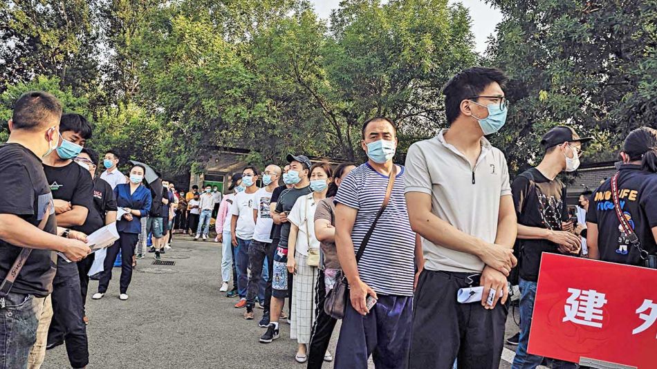 20200620_china_contagio_fila_coronavirus_brote_afp_g