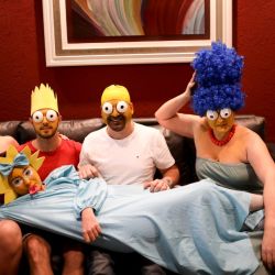 The Arévalo-Robledo family, dressed as The Simpsons, poses for a photo in their living room during a government-ordered lockdown to curb the spread of the new coronavirus in Buenos Aires, Argentina, Saturday, June 27, 2020.