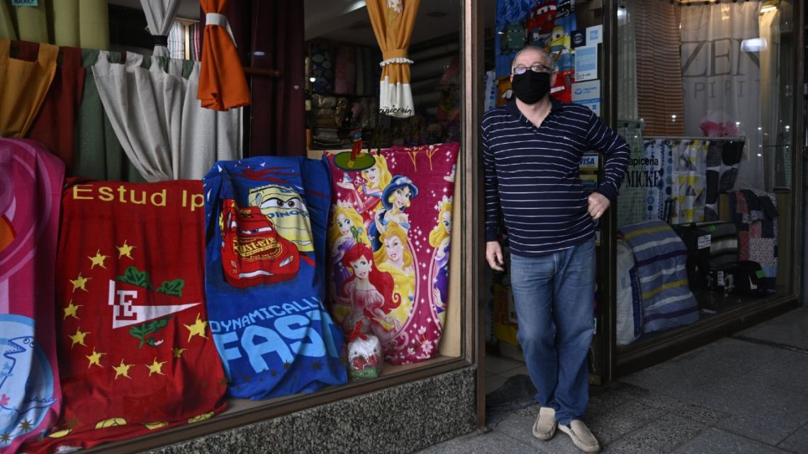 A salesman waits for costumers at his store after lockdown measures to fight the Covid-19 novel coronavirus pandemic were relaxed, in Buenos Aires, on July 20, 2020.