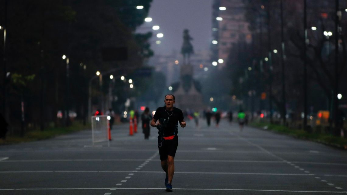 A man jogs in Buenos Aires, during the government-ordered lockdown to curb the spread of the novel coronavirus, Monday, July 20, 2020. 