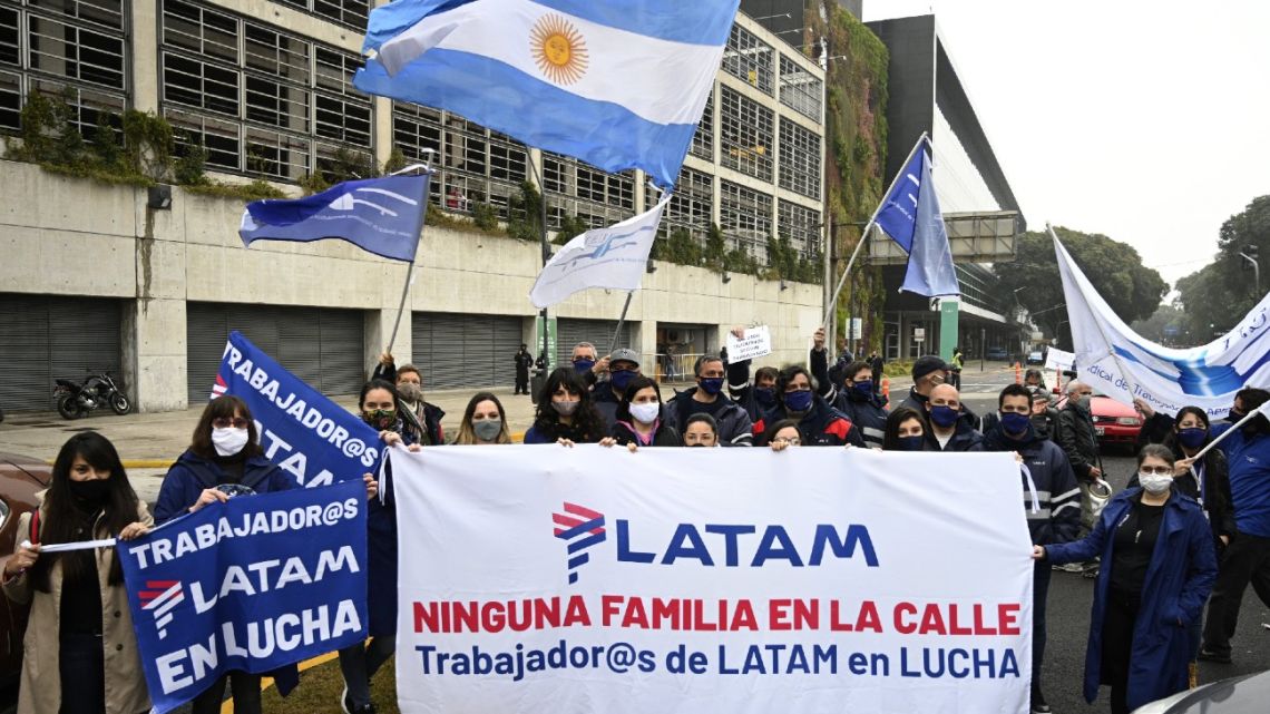 Workers of LATAM Airlines Argentina pose during a protest weeks after the company announced it was ceasing its domestic operations amid the Covid-19 pandemic, outside Jorge Newbery Airport in Buenos Aires, on July 22, 2020.