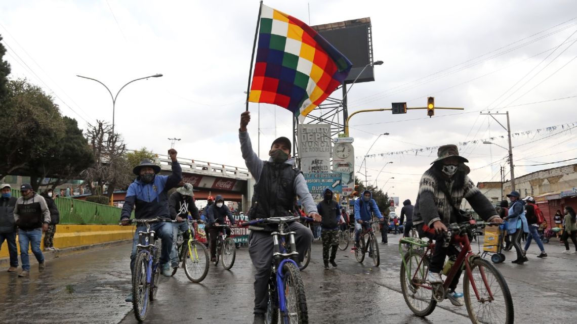 Supporters of Bolivian former president (2006-2019) Evo Morales march in El Alto to protest against a second postponement of the general election due to the Covid-19 novel coronavirus pandemic and to demand the resignation of President Jeanine Anez, in El Alto, on August 11, 2020. 