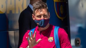In this August 13, 2020 file photo, Barcelona's Lionel Messi waves as he arrives at the the team's hotel in Lisbon, Portugal. 