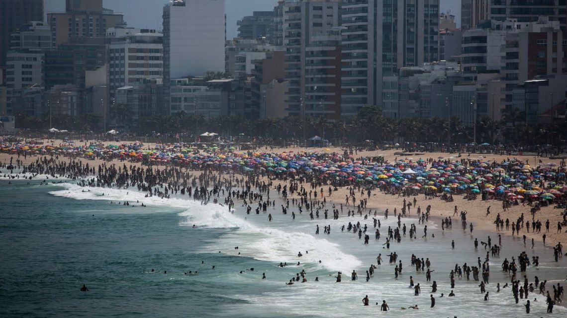 People enjoy the Ipanema beach amid the new coronavirus pandemic in Rio de Janeiro, Brazil, Sunday, September 6, 2020. 