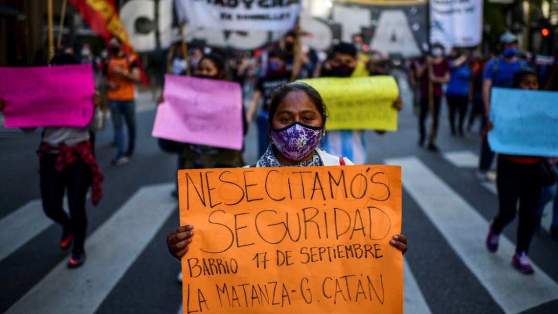 Demonstrators hold signs during a rally in Buenos Aires on September 17, 2020, during the Covid-19 pandemic. 