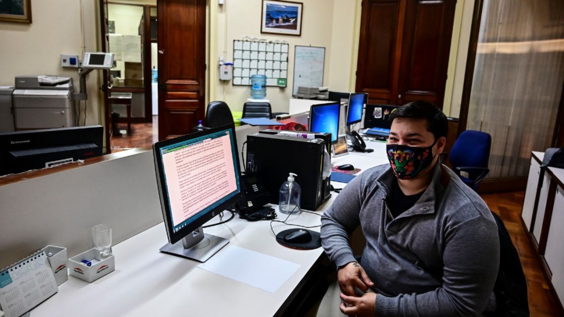Thomas Casavieja poses for a picture during an interview inside the Banco Nación branch where he works, in Buenos Aires, on September 9, 2020. 