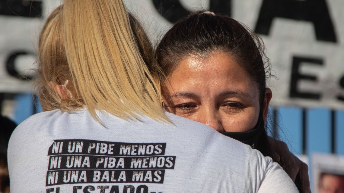 Facundo's mother, Cristina Castro (right), is embraced at a rally in early September by a demonstrator. 