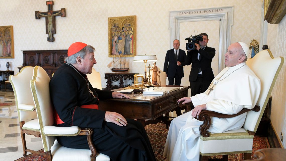 This handout photo taken on October 12, 2020 and released by the Vatican press office, the Vatican Media, shows Pope Francis (R) talking with Australian cardinal George Pell during a private audience at the Vatican. 