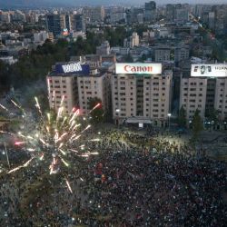 Aerial view showing demonstrators supporting the reform of the Chilean Constitution waiting for the referendum's official results at Plaza Italia square in Santiago on October 25, 2020. 