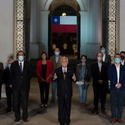 Chile's President Sebastián Piñera speaks at La Moneda presidential palace, in Santiago on October 25, 2020 following the results of the constitutional referendum voting. 