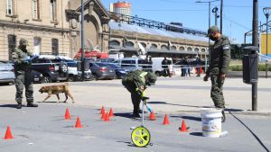 Investigators comb the crime scene after the shooting incident in Retiro, Buenos Aires.