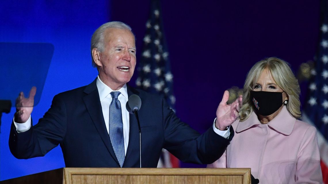Democratic presidential nominee Joe Biden, accompanied by his wife Jill Biden, speaks during election night at the Chase Center in Wilmington, Delaware, early on November 4, 2020. 