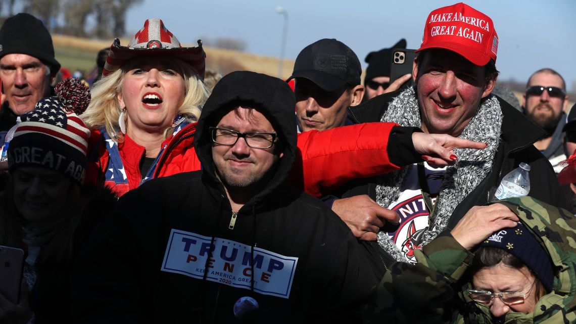 Supporters of US President Donald Trump wait in line to attend a campaign rally with the president at Rochester International Airport October 30, 2020, in Rochester, Minnesota.