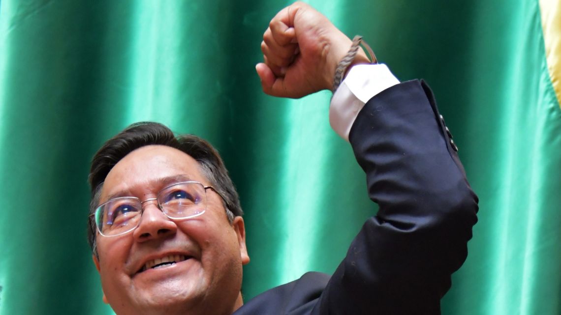 Handout picture released by the Agencia Boliviana de Informacion (ABI) showing Bolivia's new President Luis Arce gesturing after being sworn in at the Plurinational Legislative Assembly, in La Paz, on November 8, 2020. 