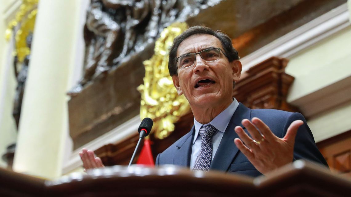 Handout picture released by the Peruvian Presidency showing Peruvian President Martin Vizcarra giving his statement and denying acts of corruption as he faces impeachment proceedings, at the Congress in Lima on November 9, 2020. The Peruvian Congress votes on November 9, 2020 on impeaching President Vizcarra, who is now accused of having received bribes for public works contracts in 2014, when he was governor of the southern region of Moquegua. 