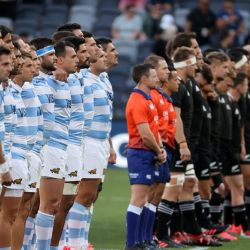 Argentina and New Zealand's players stand during the national anthems prior to the 2020 Tri-Nations rugby match between the New Zealand and Argentina at Bankwest Stadium in Sydney on November 14, 2020. 