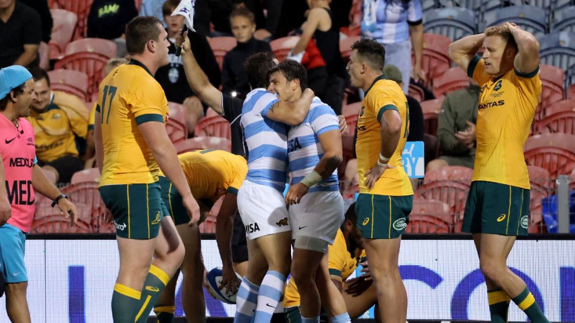 Argentina and Australian players react at the end of the 2020 Tri-Nations rugby match between the Australia and Argentina at McDonald Jones Stadium in Newcastle on November 21, 2020. 