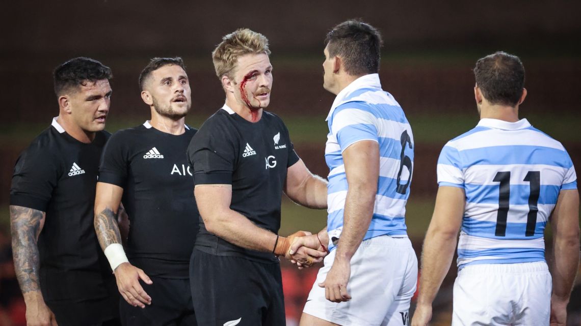 An injured New Zealand team captain Sam Cane shakes hands with Argentina players after their 2020 Tri-Nations rugby match between New Zealand and Argentina at the McDonald Jones Stadium in Newcastle on November 28, 2020. 