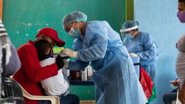 Healthcare workers of the San José Hospital mobile unit treat Venezuelan migrants at a closed school in Maicao, La Guajira, Colombia.