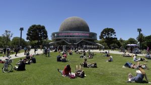 People gather at the Galileo Galilei planetarium to watch the partial solar eclipse in Buenos Aires on December 14, 2020.