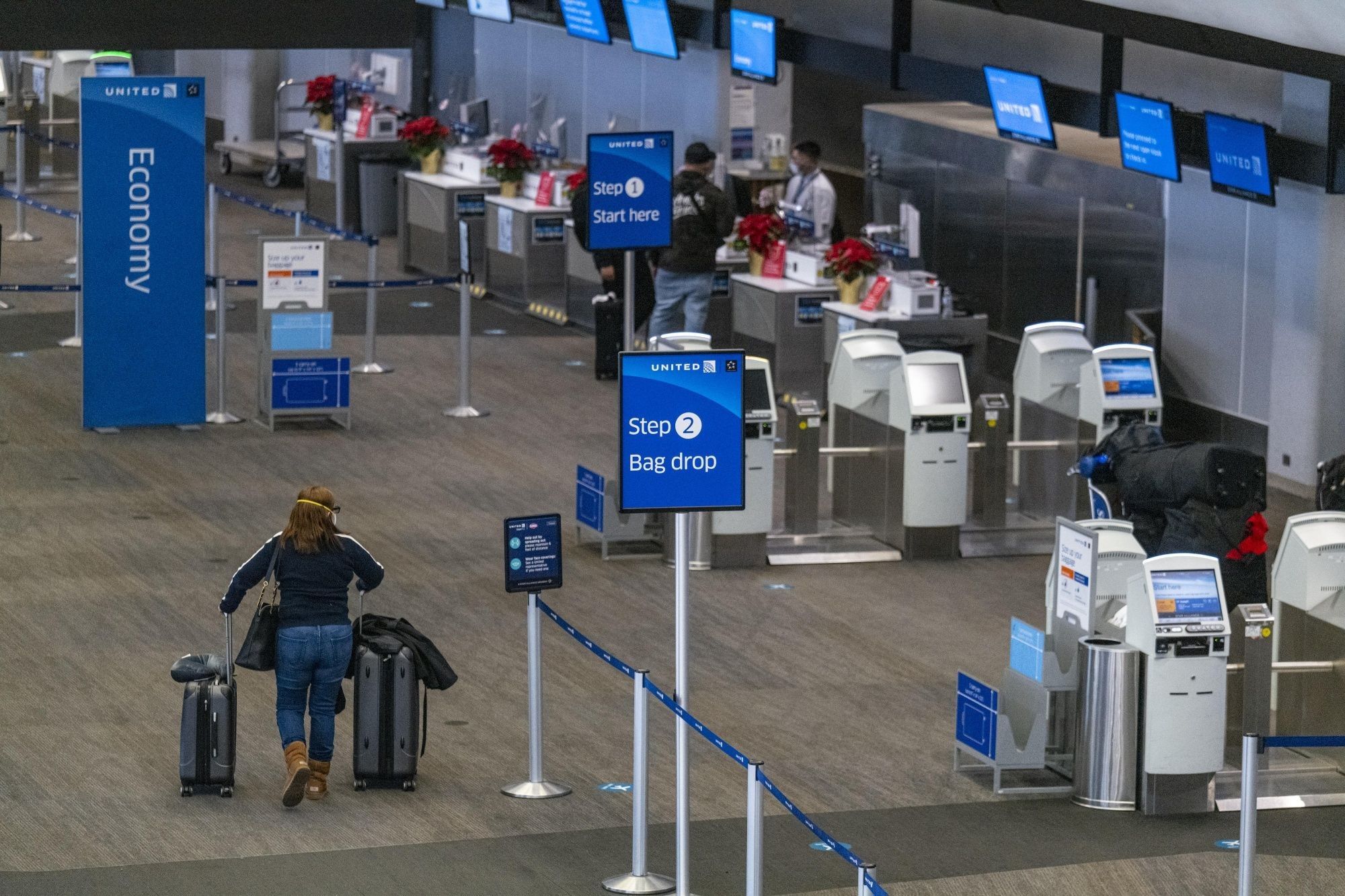 Travelers At SFO Airport Ahead Of Christmas Holiday