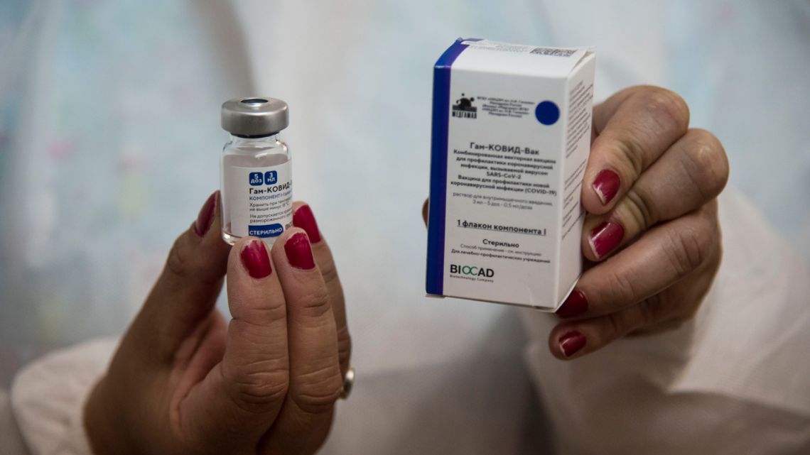 A health worker shows a vial of the Sputnik V vaccine at the Centenario Hospital in Rosario, Santa Fe Province,