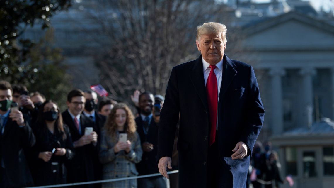 US President Donald Trump walks by supporters outside the White House on January 12, 2021.